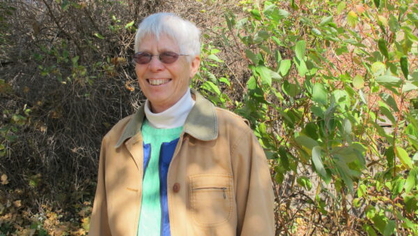 St. Paul resident Jeanne Weigum poses in a garden.